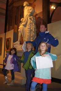 Posing beside George Washington statue